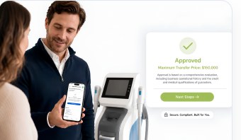 A customer reviewing an approved financing offer beside a medical device