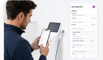 A sales rep submitting a financing application on a phone